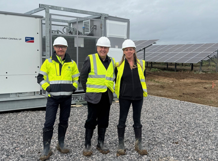 Sir John is pictured with Tim Humpage, CEO of British Solar renewables, and Carla Hardaker, Development Director.