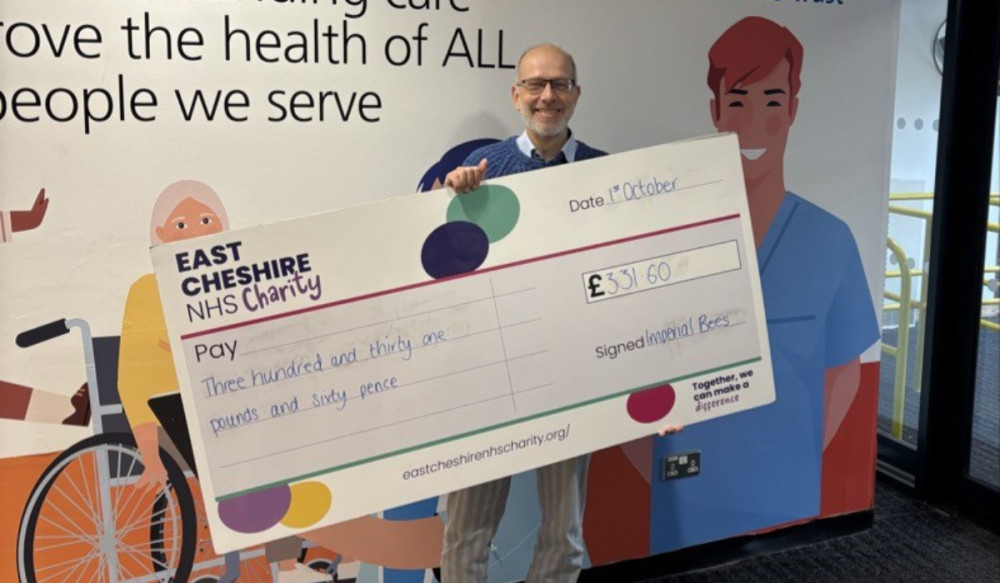 Jochen Fischer with the cheque for East Cheshire NHS Trust Charity (Credit: NHS)
