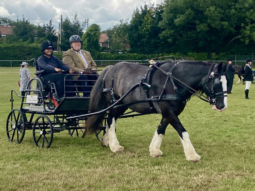 Peter Tomlin (pictured with ridig particpant Lauryn) is a riding coach at Teddington's Park Lane Stables (Image supplied)