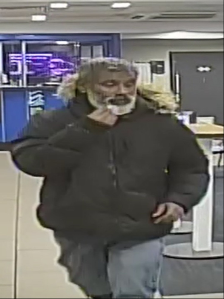 On Wednesday 15 October, an unknown man entered William Hill, Nantwich Road, stealing cash from a till after asking staff for water (Photo: Cheshire Police).