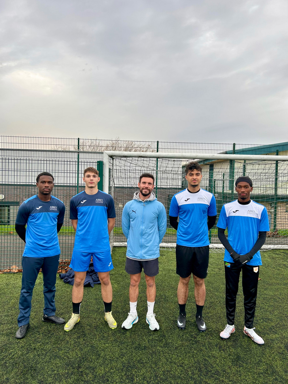 Abbey College Manchester Head Football Coach, Richard Barrow (centre) Pictured with Players (credit Abbey College)