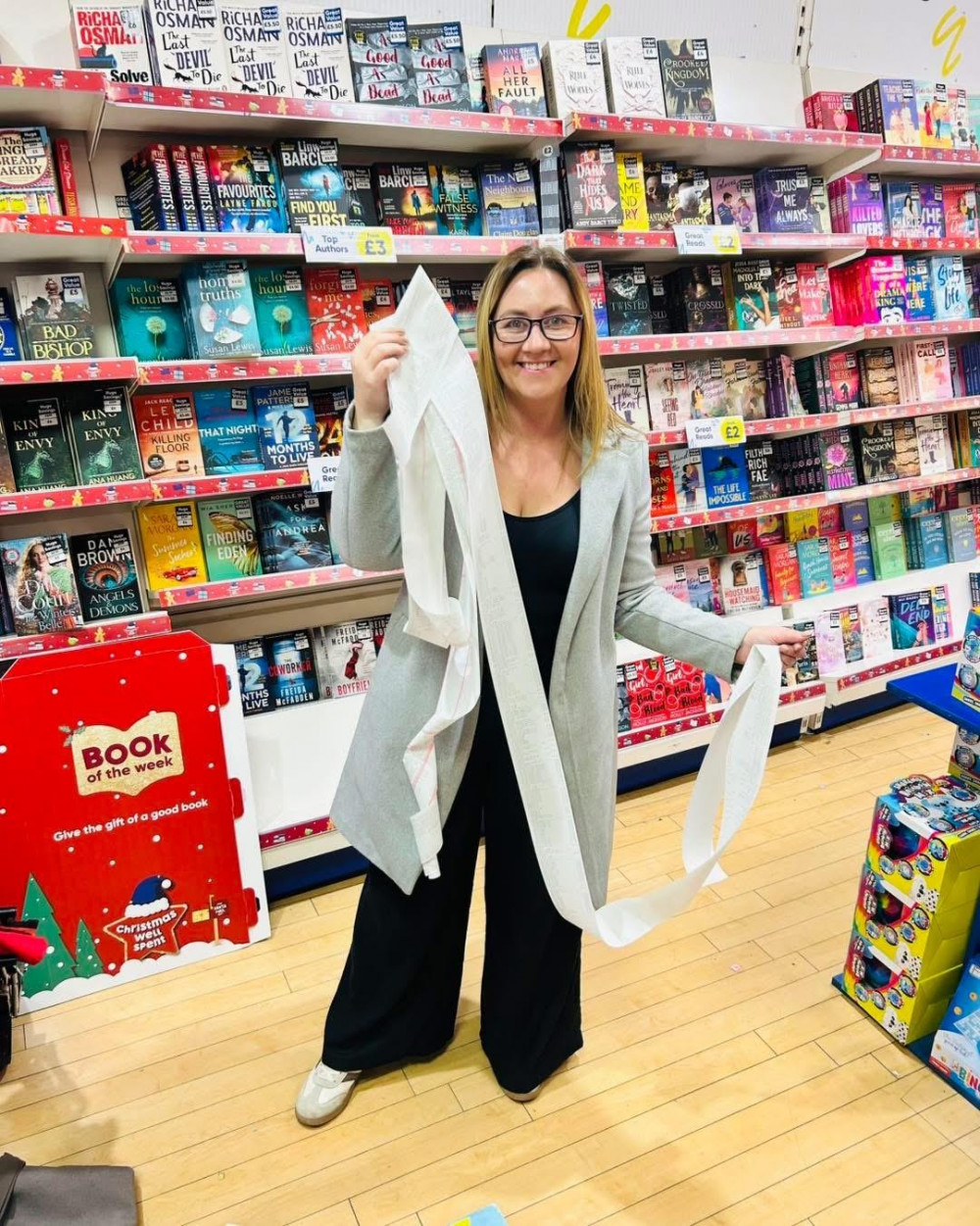 Rebecca Winfield purchasing books with the funds raised (image via Literacy for Life)