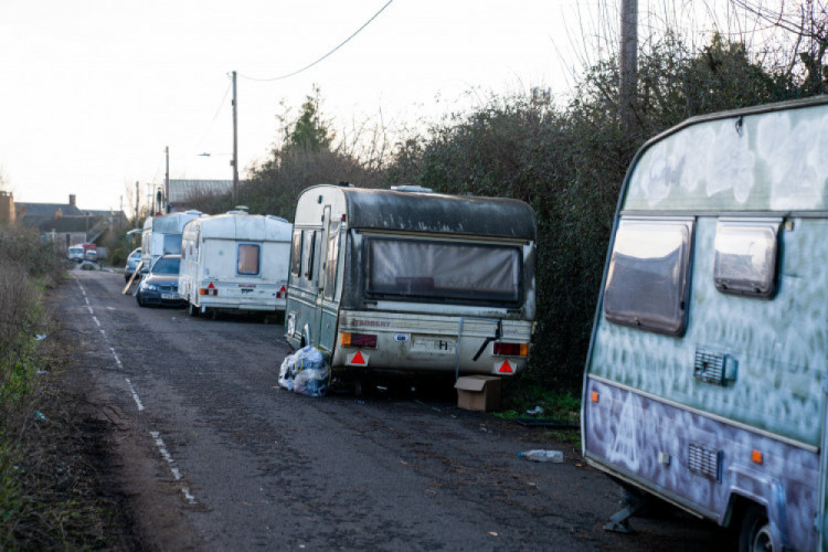 Glastonbury faces caravan crisis, with abandoned vans and unsafe dwellings. 