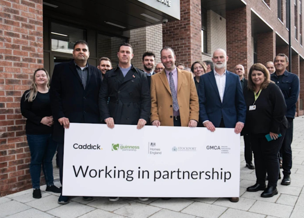 Stockport MP Navendu Mishra (second from left) and Stockport Council leader Mark Roberts (third from right) alongside representatives from The Guinness Partnership and Homes England (Image - Stockport Council)