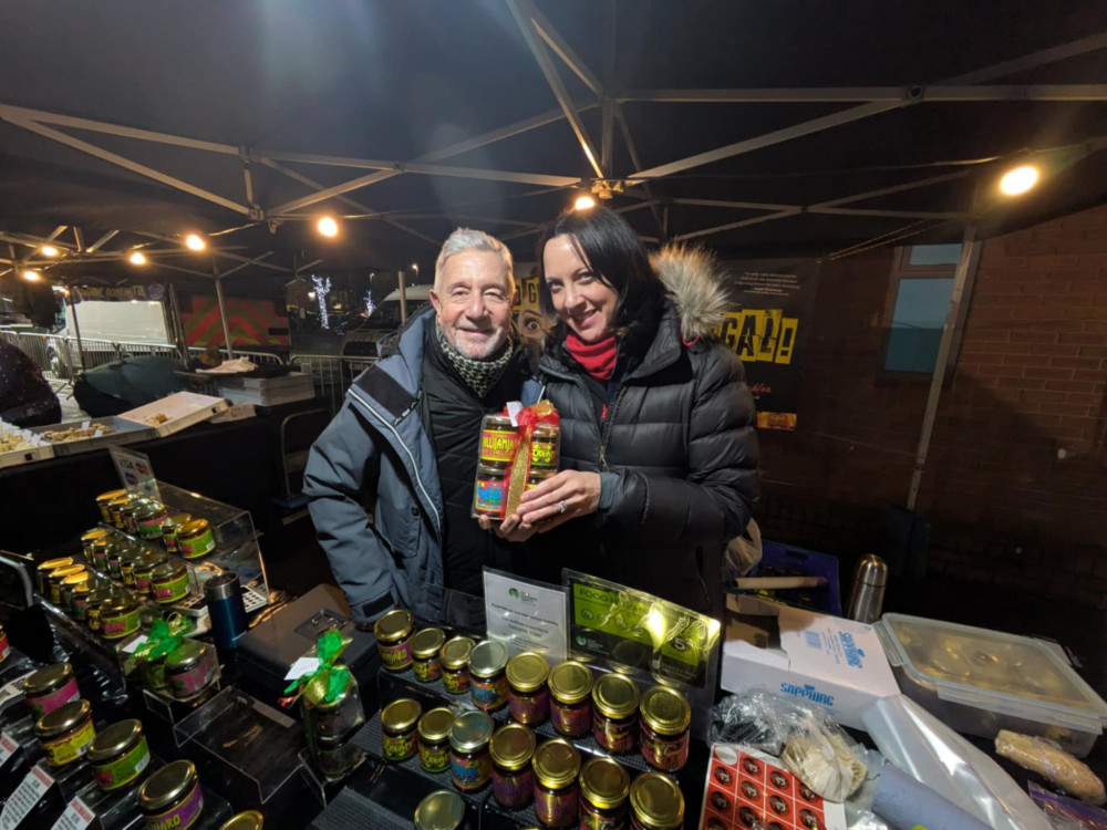 Mani Alias, the original drummer with Tears for Fears, and his partner actress Deborah Bouchard at Sandbach Christmas Market with their chilli business. (Photo: Nub News) 