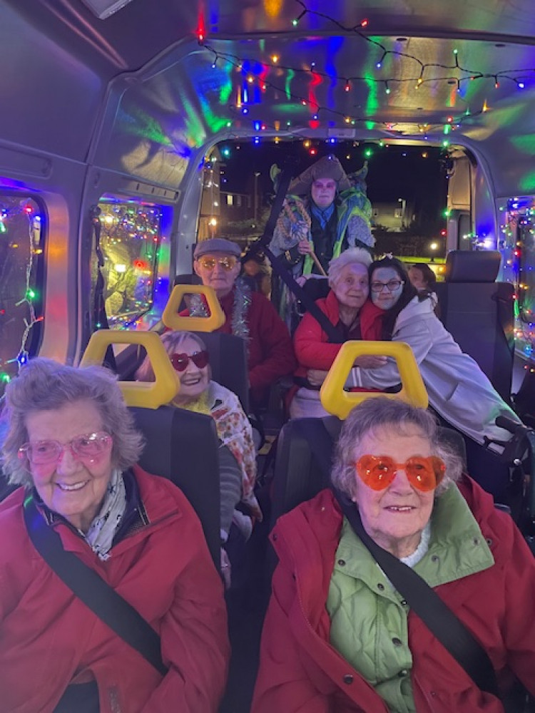 Residents from Crandon Springs Care Home enjoyed taking part in the Wells Carnival, waving at the crowds from inside their party bus!