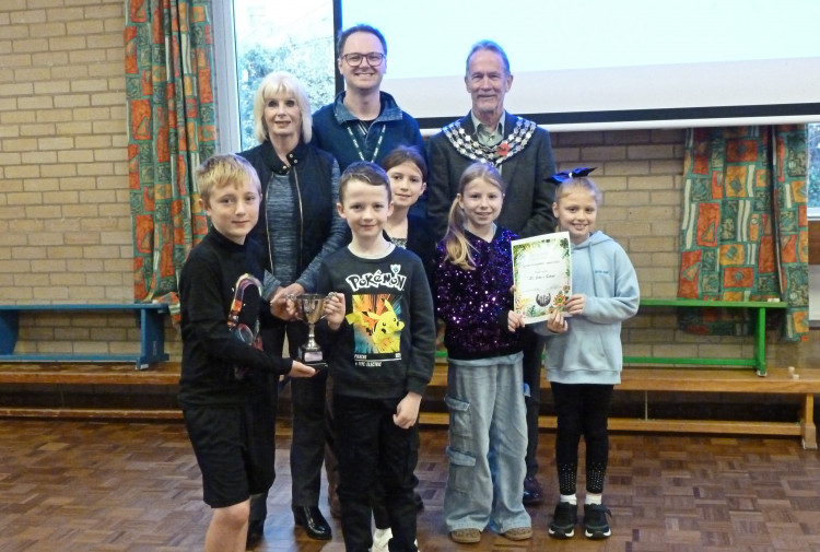 Cup and gold certificate presentation at St John's morning assembly
