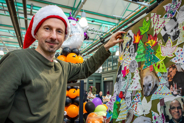 Album Organiser, Mark Sheeky, with the Christmas Tails album artwork (Photo: Peter Robinson).