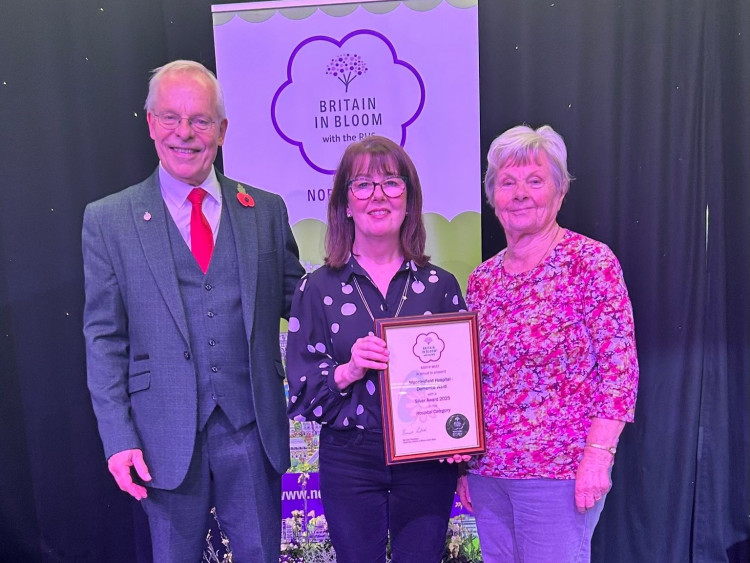 Activities co-ordinator Lisa Nixon (centre) and volunteer Elizabeth (right) receive their award at North West in Bloom Awards (Credit: ECNHST)