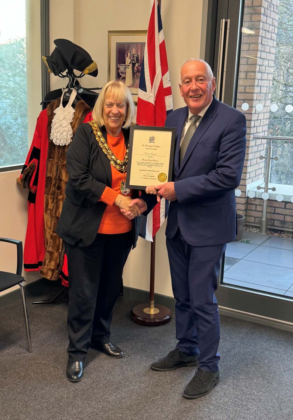 Mayor Cllr Sue Shinnick presents Martin with his certificate of recognition.