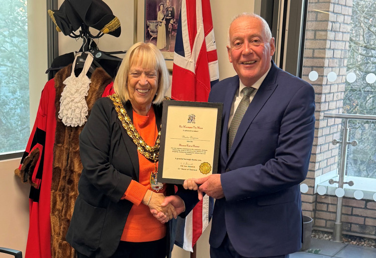 Mayor Cllr Sue Shinnick presents Martin with his certificate of recognition.