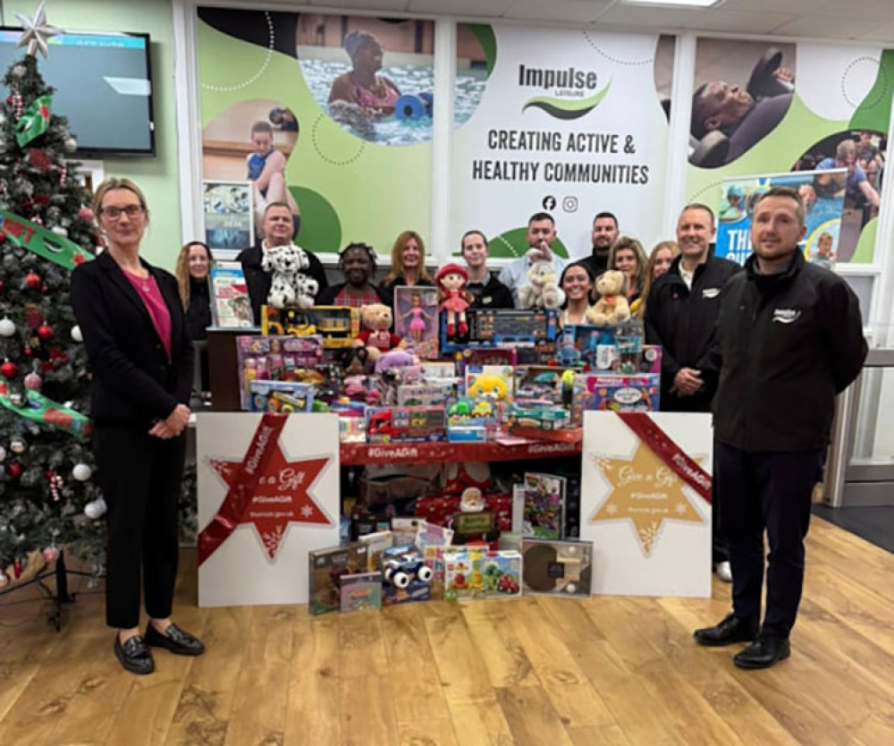 Cllr Hartstean with staff at Impulse Leisure and the donated toys.