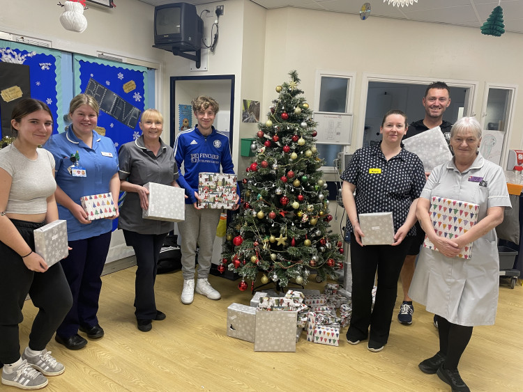 : Staff on the Children’s Ward are joined by Macclesfield FC Community Sports Trust at last year’s visit.