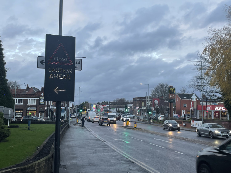 A flood caution sign outside the McVitie’s factory in Heaton Chapel (Image - Nub News)
