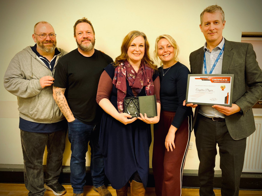 Rachel Wood (red scarf) displays her award alongside Emily Bourne (Credit: ECNHST)