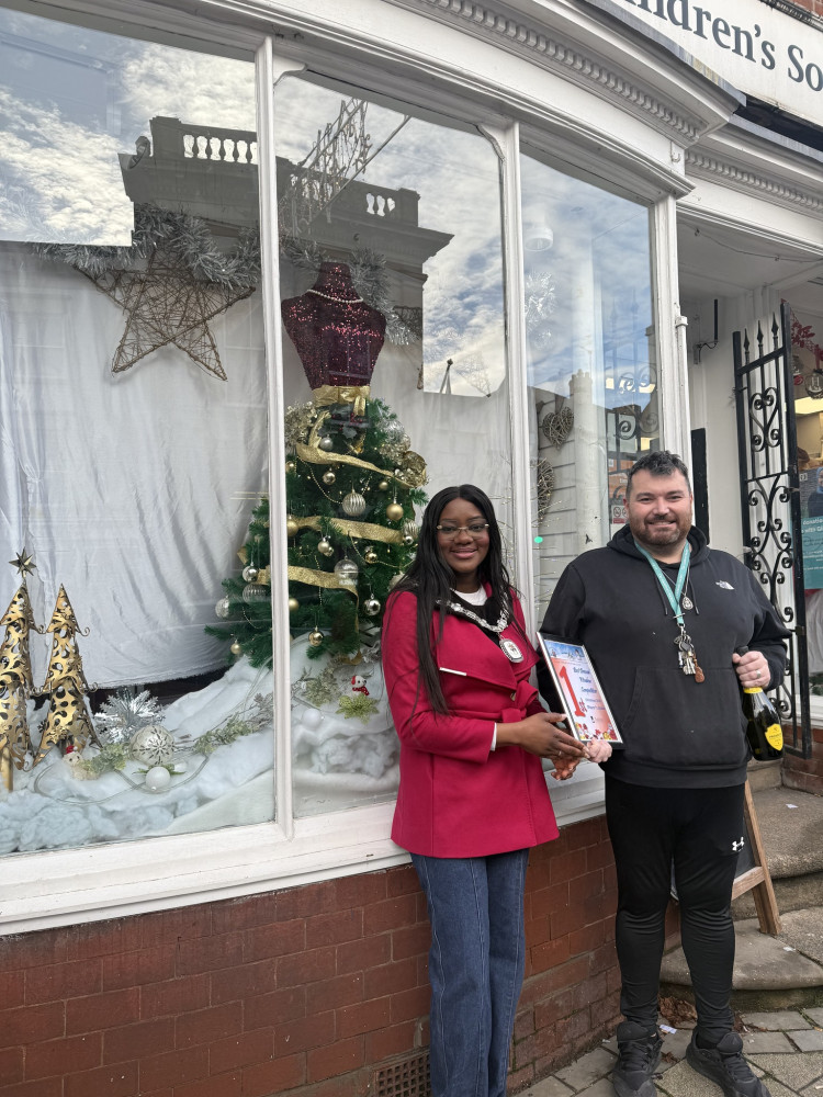 Ashby's Mayor with the Best Dressed Window competition winner (Photo: Ashby Town Council)