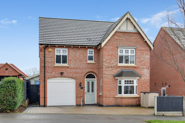 Attractive four-bed detached home with driveway parking and integral garage in the desirable Ashby Gardens estate