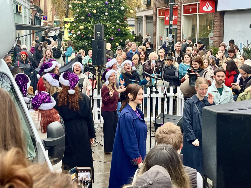 Residents enjoyed carols, free festive tasters and a special appearance from the pop star as Ocado’s ‘Season’s Eatings’ campaign (credit: Nub News).