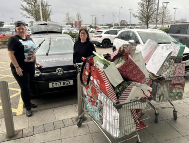 Louise accepts the gifts from Elaina at Dunelm