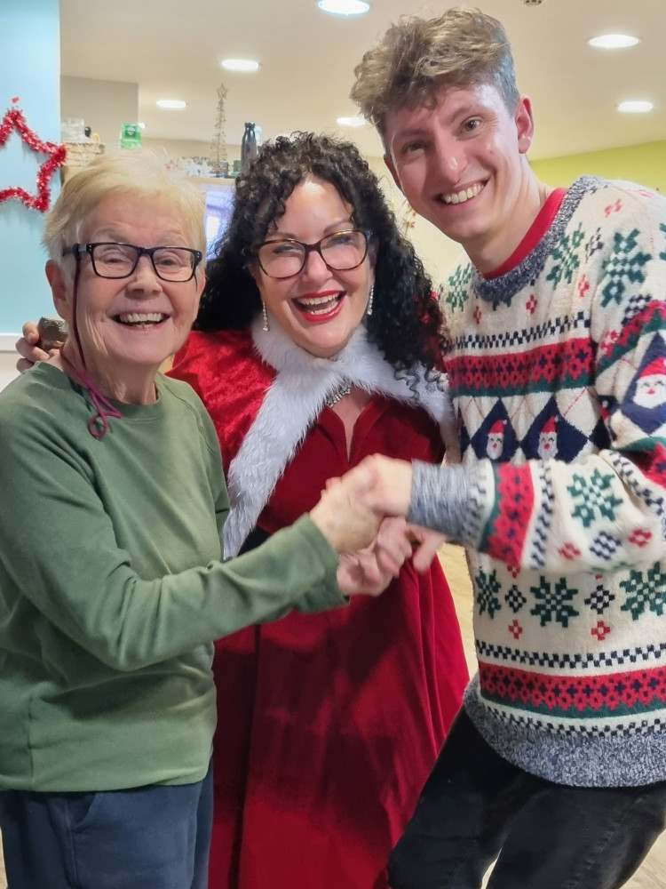 L-R Resident Pat Palmer; singer Maria Florey; Matthew Salter