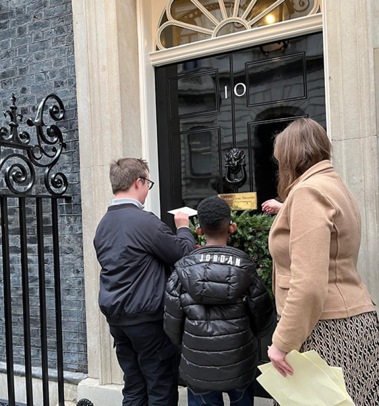 Local young people helped Jen Craft deliver the letter. 