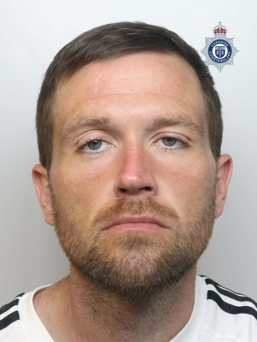 Daniel Critchley is wanted on recall to prison (Photo: Cheshire Police).