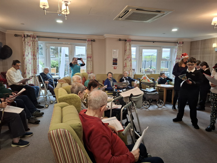 Residents at Sherwood Grange in Kingston Vale were treated to a special carol concert, performed by Canbury School (Image supplied)