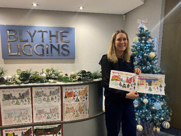 Donna Bothamley, Partner at Blythe Liggins Solicitors, with the winning entries of this year’s festive colouring competition (image supplied) 