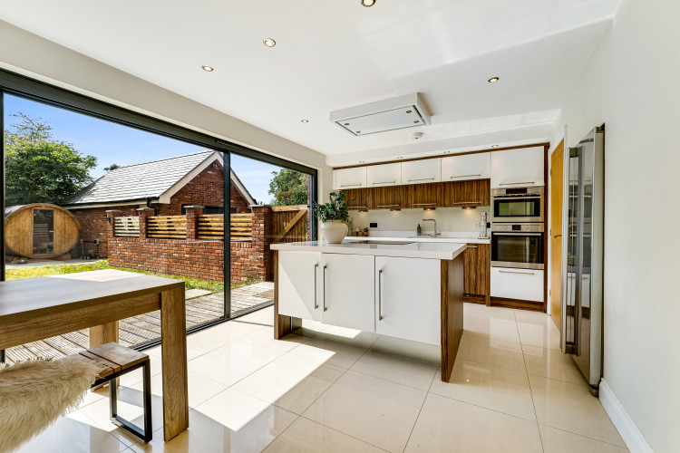 The impressive open-plan kitchen and dining area forms the heart of the home (Thornley Groves)