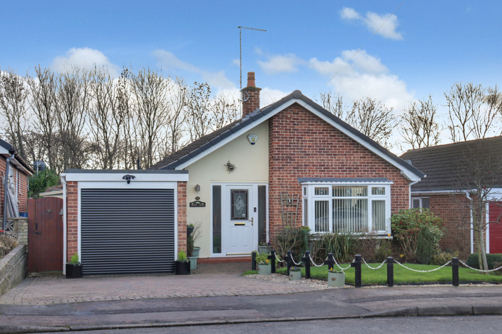 Attractive detached bungalow with driveway parking, integral garage and a welcoming frontage