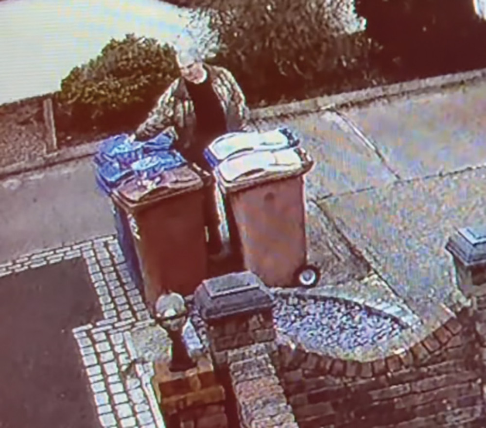 The thief takes the sweets from top of waste bins.