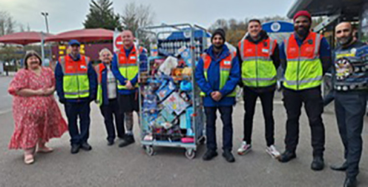 East Tilbury Primary School also distributed gifts. Pictured handing over the gifts are, from left, some of the drivers at Tesco and store manager Amit Sarmotta with representatives of the school.