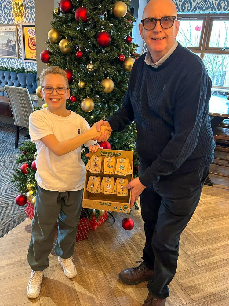 Wistaston Church Lane Academy pupil, Wilson Laurie, 11, with area manager at Greene King, Rob Keithley (Photo: Supplied).