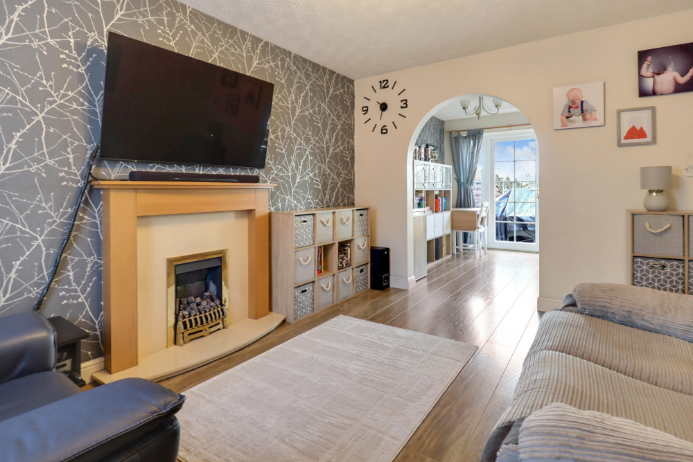 A bright and spacious open-plan living and dining area, ideal for family life and entertaining, with French doors to the garden