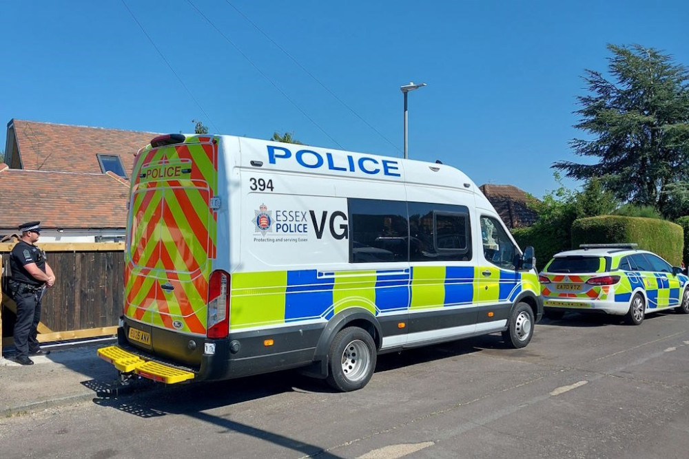 Police outside Oaveed Rahman's property.