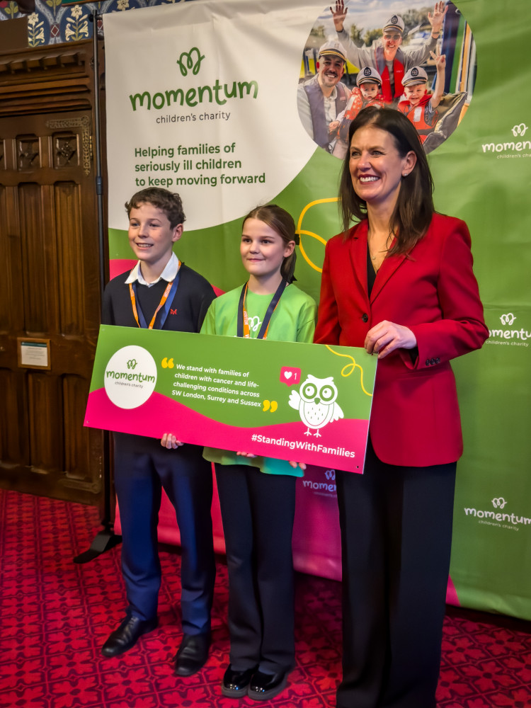 Howard Thomas, Thea Rogers and Monica Harding MP at Westminster (Credit: Momentum Children's Charity)