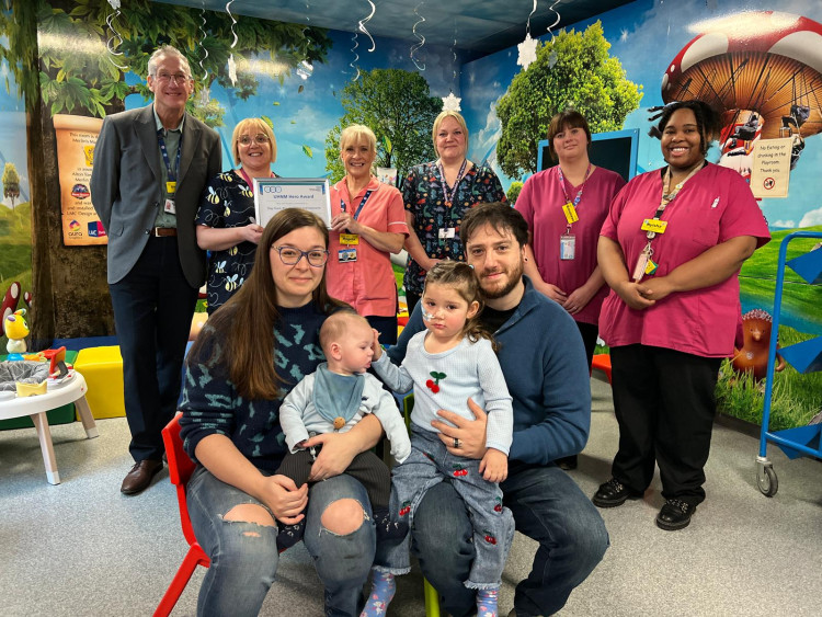 The UHNM play team were presented with the award by the family and Dr Simon Constable (image via UHNM)