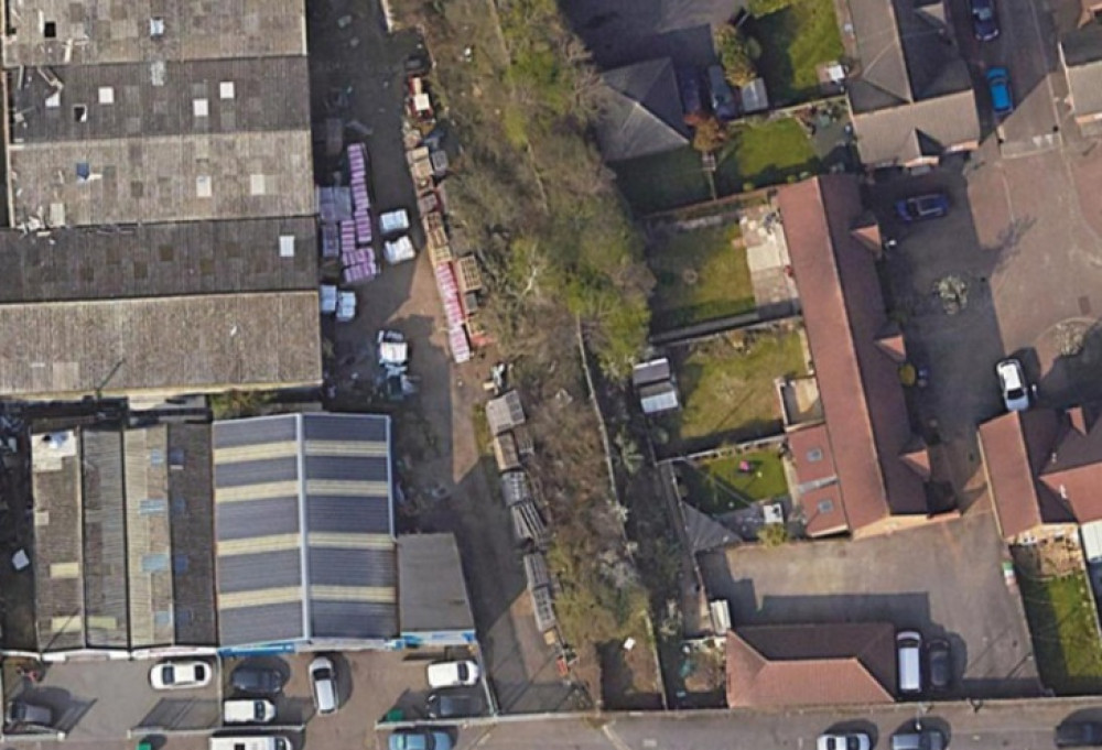 The scrubland zone between commercial properties and homes