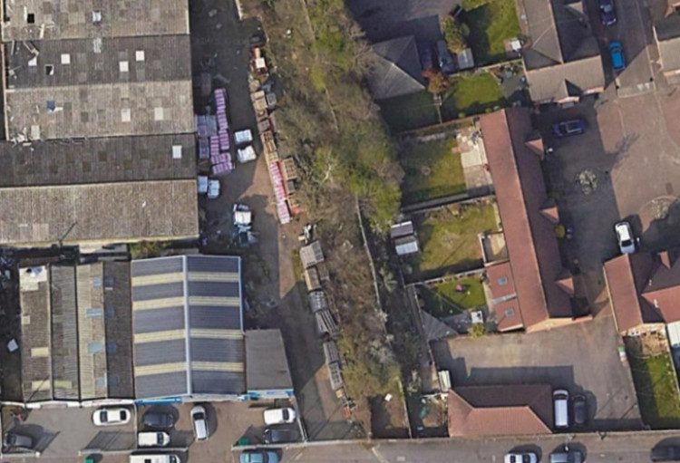 The scrubland zone between commercial properties and homes