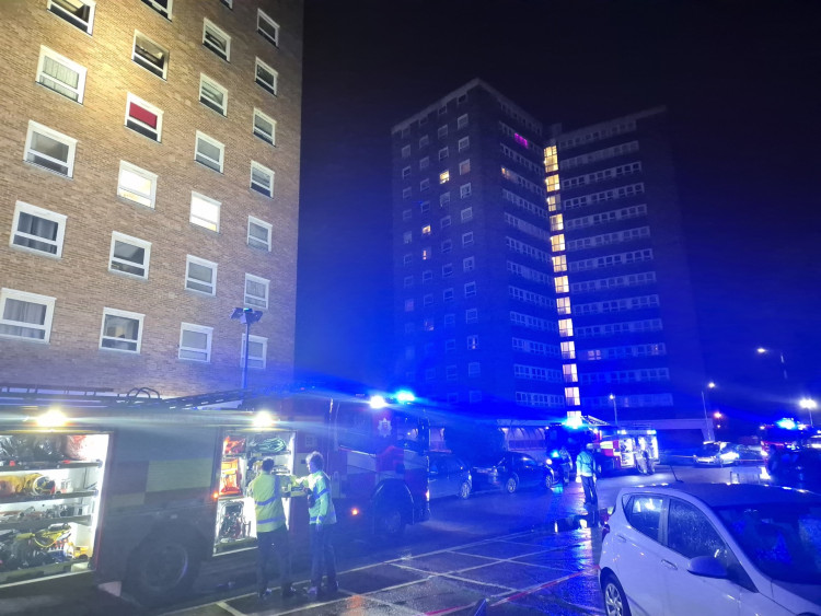 Crews on the scene this evening. The affected flat was on the fifth floor of George Tilbury House (top left in the picture). 
