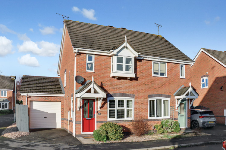 Attractive two-bedroom semi-detached home with private driveway and garage, tucked away in a quiet Ashby cul-de-sac