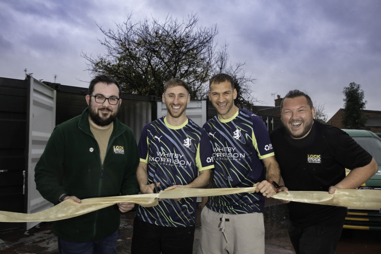 Crewe Alexandra FC's Mickey Demetriou and Louis Moult cut the ribbon at Lock Stock Self Storage’s new site in Crewe, located on the corner of Catherine Street and Francis Street (Photo: Lock Stock).