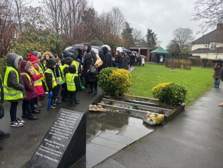 The rain did not stop tributes being paid to Holocaust and genocide victims on another moving day at the Herbert E. Brooks Memorial Garden