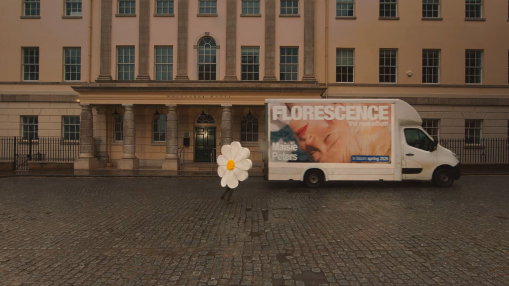 The artist was spotted running through Richmond Riverside in a daisy costume in a trailer revealing her third studio album (credit: Maisie Peters/YouTube).