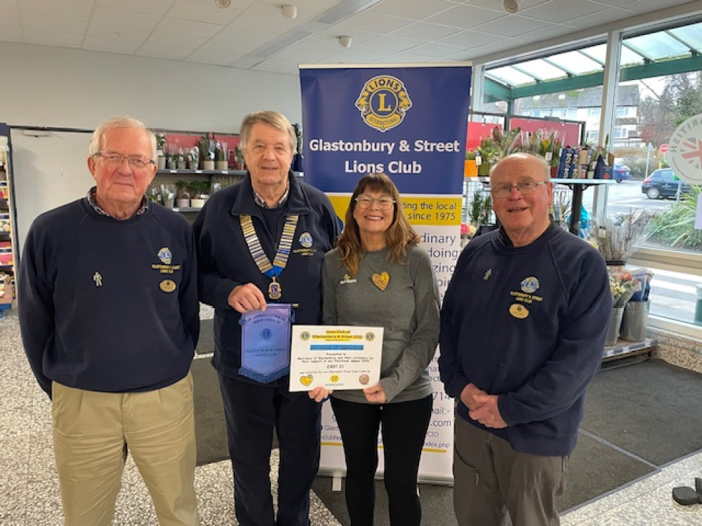 From left to right Lion Peter Hopwood, Lion President Peter Cole, Community Champion at Morrisons, Stella, and Lion John Mulliner (Supplied) 