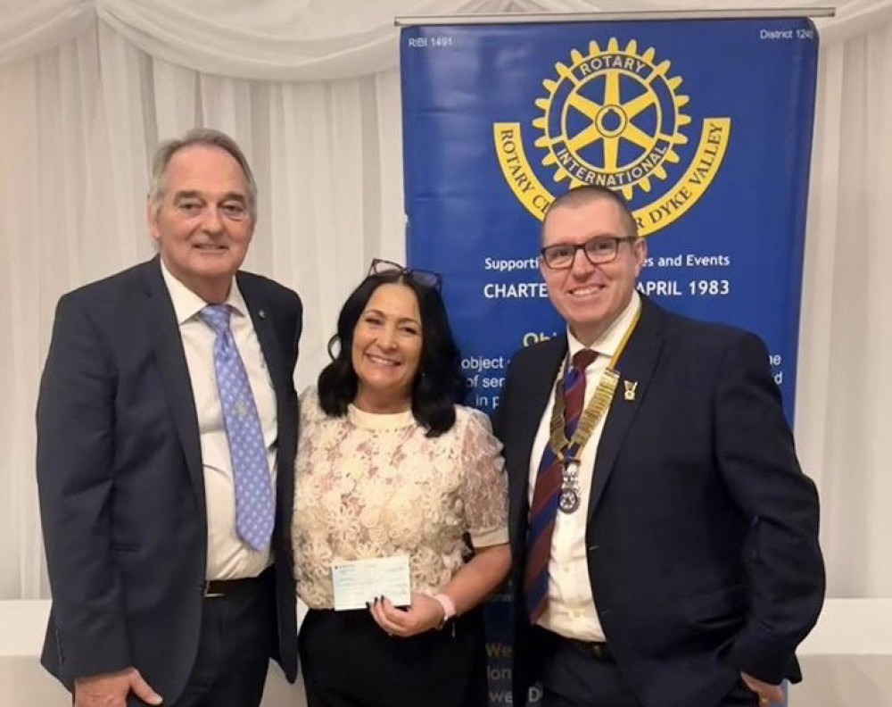 Sarah Barnes flanked by Rotary secretary Graham Dockrill (left) and its chairman Paul Luke.