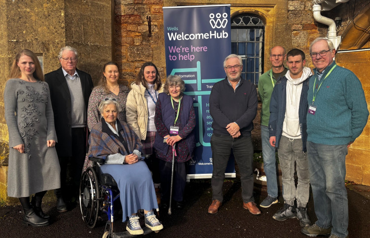Martyn Starnes, fourth from the left, with Ukrainian refugees with former Lord-Lieutenant of Somerset Annie Maw and WCN volunteers who support them at the Wells Welcome Hub 