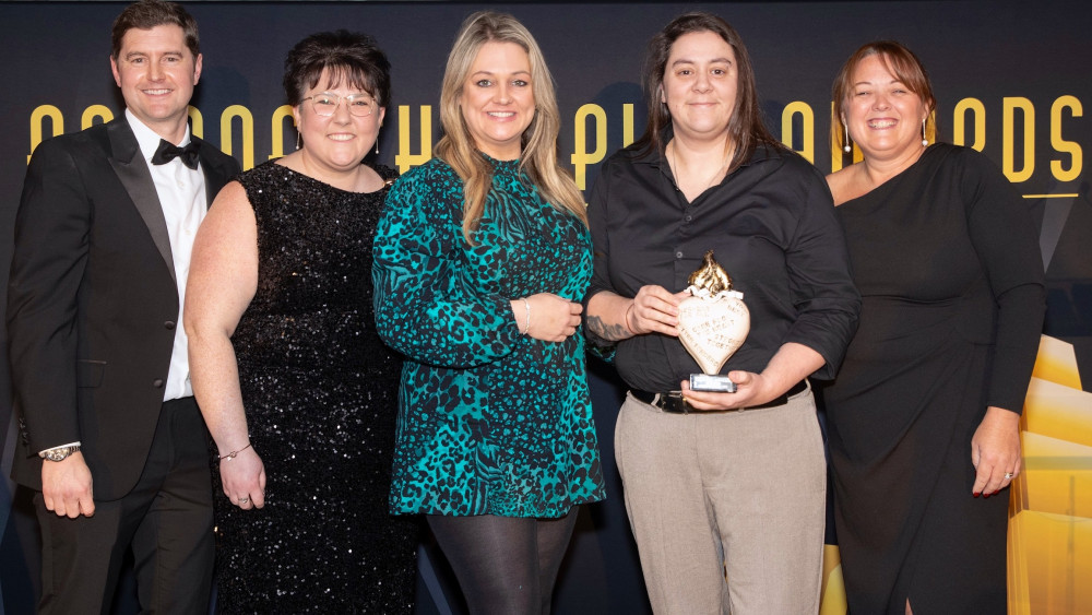Belong Newcastle-under-Lyme's Emma Palin celebrates her success at the dementia specialist's annual Champion Awards (image via Belong)