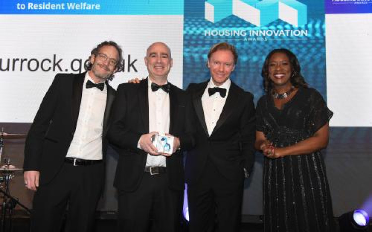  CHIP Team members Alex James (Outreach Worker, left) and James Lakey (Principal Psychologist & Team Lead, holding award) with representatives from the Housing Innovation Awards team