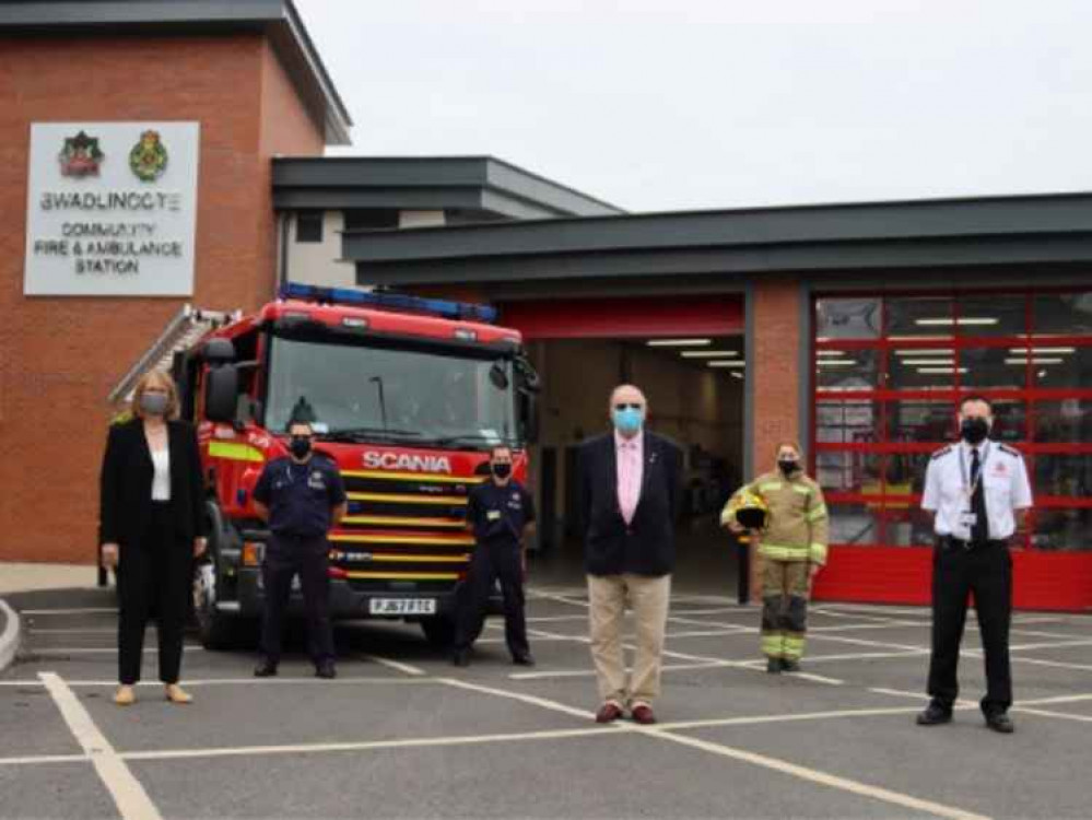 Christine Fearns (front left), William Saunders (front middle) and Gareth Murtagh (front right) with staff at Swadlincote Community Fire and Ambulance Station